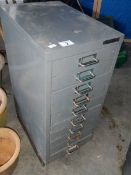 A small 10 drawer metal cabinet.