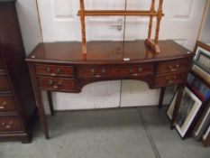 An inlaid darkwood stained bow front chest/sideboard