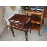 A Lloyd Loom Chair, a tea trolley and a small single drawer table.