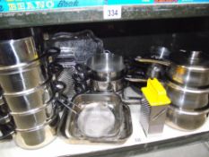 A large selection of stainless steel saucepans,