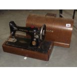 A vintage oak cased Singer sewing machine
