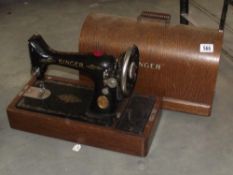 A vintage oak cased Singer sewing machine