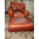 A good leather arm chair and an ottoman.