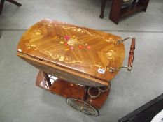 A floral inlay tea trolley.