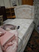 An electric 3 foot divan with headboard.