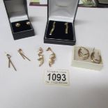 A pair of 9ct gold earrings and 4 pairs of unmarked yellow metal earrings.