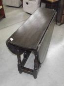 A period oak gate leg table.