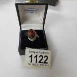 A silver ring set amber, size H.