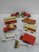 A mixed lot of Dinky and Corgi including Landrover, bust, milk float, tractors etc.