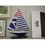 A boxed wooden racing yacht model by Leonardo