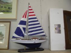 A boxed wooden racing yacht model by Leonardo