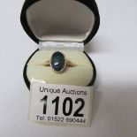 A 9ct gold ring set irridescent stone, size P half, total weight 3.6 grams.