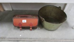 A Victorian brass jam pan and a pair of lawn bowls in bag