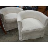 A pair of tub chairs.