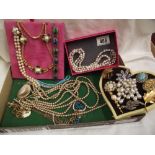 A mixed lot of necklaces, brooches etc.