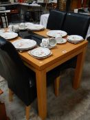 A good kitchen table and 4 leather seat chairs.