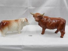 A Coopercraft highland bull and an unmarked bull.