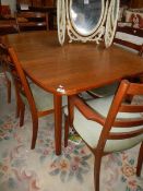 A good oak dining table and 6 chairs.