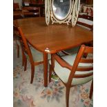 A good oak dining table and 6 chairs.