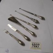 3 silver handled button hooks,