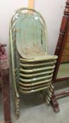 6 old metal stacking chairs.