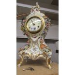 A Dresden porcelain clock with key.