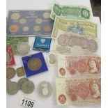 A mixed lot of coins and UK bank notes.
