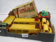 A boxed tinplate Welso toys T732 bulldozer and 4 Bedford lorries including 2 transporters.