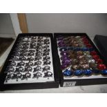 2 trays of costume jewellery including cat rings, large jewelled rings etc.