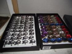 2 trays of costume jewellery including cat rings, large jewelled rings etc.