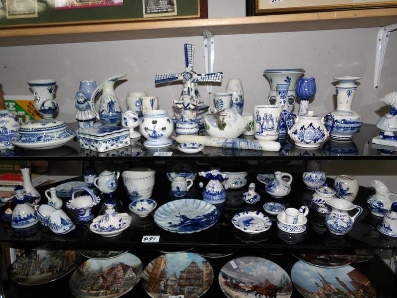 2 shelves of Delft hand painted pottery, some a/f.