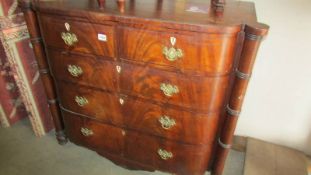 A Victorian mahogany bow front chest of drawers with side pillars and brass handles (collect only).