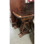 A nest of 3 good quality lyre end tables.