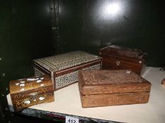 A Victorian tea caddy, a carved teak box and 2 inlaid boxes.