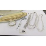 A triple row Lotus pearl necklace, 4 crystal necklaces and a silver napkin ring. (11 grams).