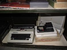 A vintage Erika typewriter, desk calculator etc.