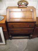 A 1930's oak bureau (collect only).