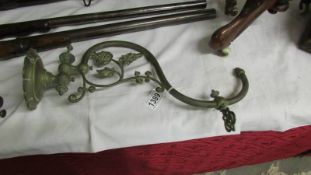 An art nouveau brass gas wall light.