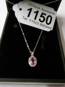 An 18ct white gold pink sapphire and diamond pendant necklace ot 60 points.
