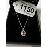 An 18ct white gold pink sapphire and diamond pendant necklace ot 60 points.