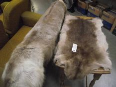 2 fur rugs.