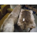 2 fur rugs.