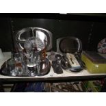 A box of silver plate cutlery and other items.