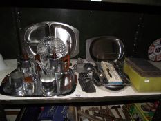 A box of silver plate cutlery and other items.