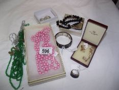 A mixed lot of costume jewellery including pink & green necklaces, Isle of Wight pearl necklace,