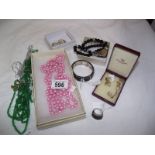 A mixed lot of costume jewellery including pink & green necklaces, Isle of Wight pearl necklace,