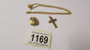 A yellow metal chain, locket and cross (all test as gold).