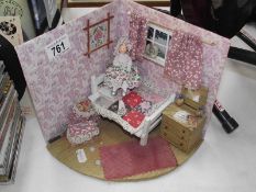 A doll house diorama with doll.