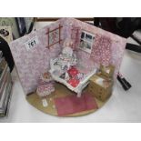 A doll house diorama with doll.