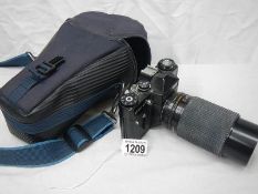 A cased Zenit camera.